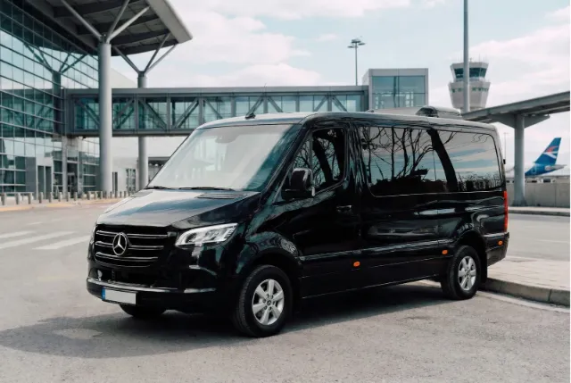 Black Mercedes-Benz Sprinter minibus with room for groups and cruise luggage